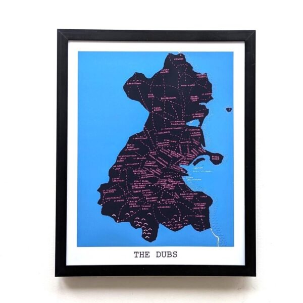 Framed blue map of County Dublin labelled "The Dubs." Map features the names of GAA clubs throughout the county. Simple, modern design on a plain wall.