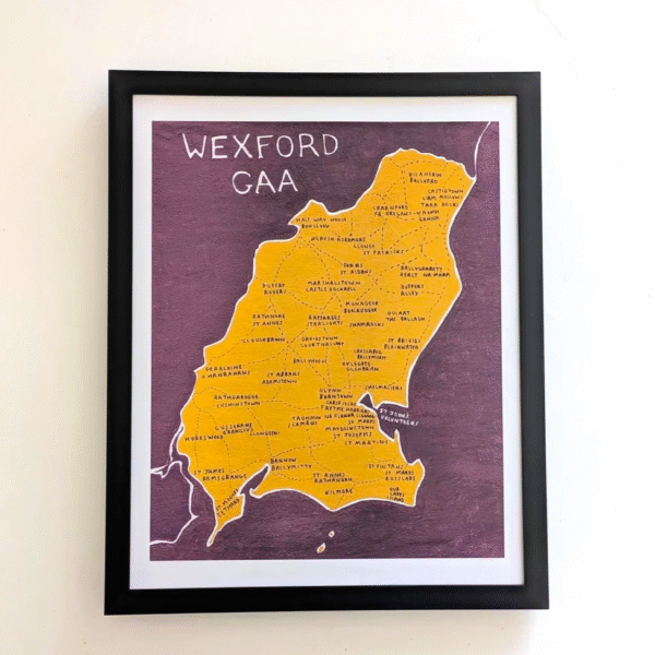 Framed map of Wexford GAA. Yellow county outline with town names on a purple background. Bold text at the top reads “Wexford GAA.”