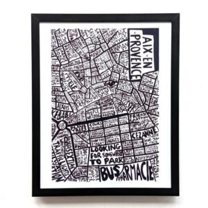 Framed black and white graphic map of Aix-en-Provence with hand-drawn text labels. The design is artistic and detailed, conveying a sense of creativity.
