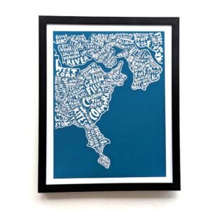 Framed map of the area around Kinsale filled with various place names and phrases in white text on a blue background, mounted on a white wall.