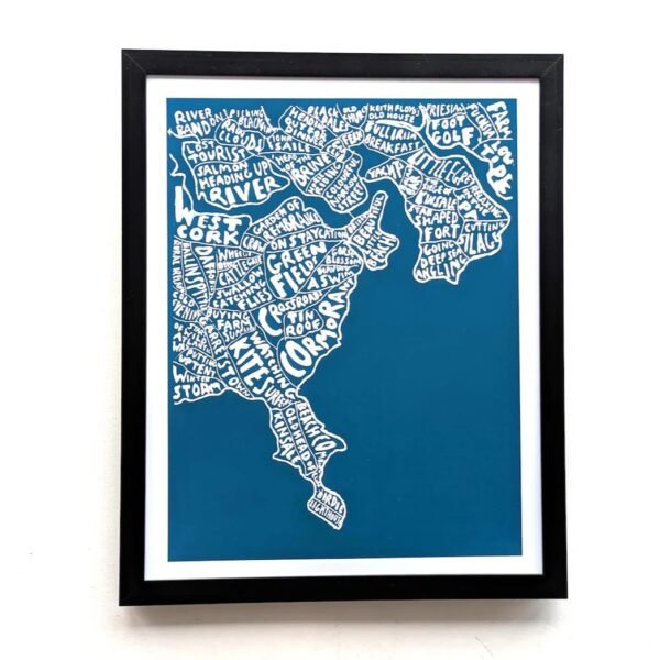 Framed map of the area around Kinsale filled with various place names and phrases in white text on a blue background, mounted on a white wall.