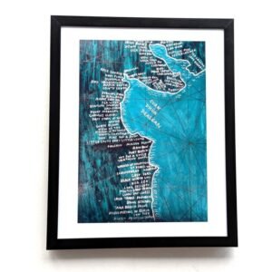 Framed artwork depicting a stylized map of the Louth coastline with handwritten white place names. The map's design features intricate lines and textures.