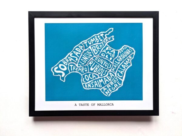 Framed map of Mallorca with food names creatively forming the island's shape on a blue background. Text below reads, "A Taste of Mallorca."