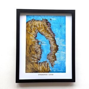 Framed vintage-style map of Strangford Lough with detailed blue and green illustrations and white handwritten labels, evoking a nostalgic tone.