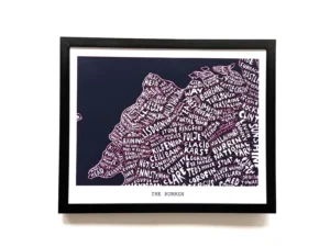 Framed typographic map art of The Burren, featuring white place names creatively arranged to form the shape of the region, set against a dark background.