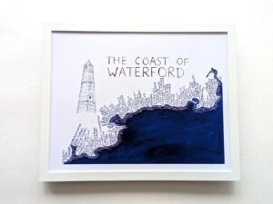 Framed artwork titled "The Coast of Waterford" shows a detailed map-like design of Waterford's coastline. A round tower sketch appears on the left.