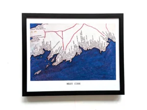 Framed map of West Cork, featuring a detailed coastline drawn in red and blue hues. Place names are visible, conveying a sense of exploration.