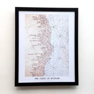 Framed artwork titled "The Coast of Wicklow" shows a stylized map with dense red text and intricate dotted lines on a pale background, evoking a vintage map aesthetic.