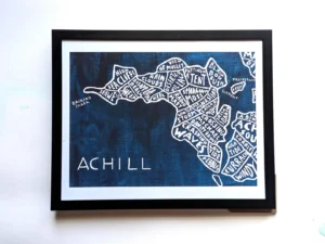 Blue-toned map artwork depicting Achill Island, filled with descriptive words like "Sea Cliffs" and "Waves." The mood is artistic and creative.