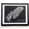 Framed artwork depicting an island map with place names in white on black, labeled “Cléire.” The tone is artistic and geographic. Keywords: map, island, art.