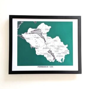 Framed map of Fermanagh GAA on a white wall. The map is set against a dark green background, featuring town names outlined in black.