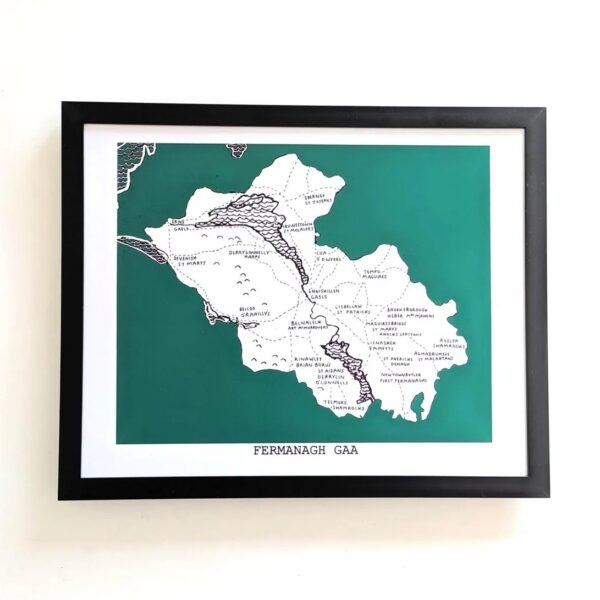 Framed map of Fermanagh GAA on a white wall. The map is set against a dark green background, featuring town names outlined in black.