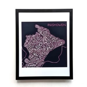 Framed map artwork titled "Inishowen" features outline filled with white place names on a dark background. Simple and elegant display on a plain wall.