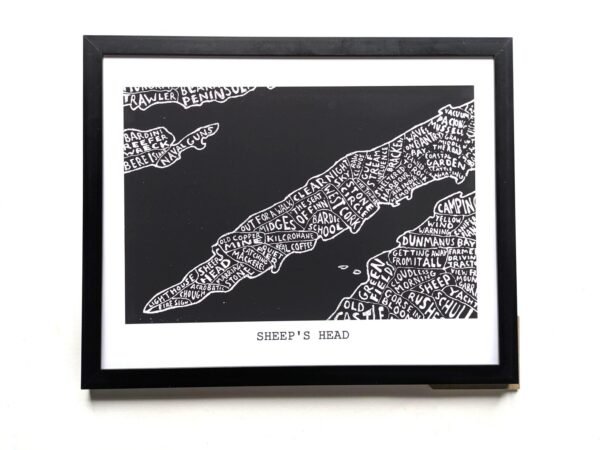 Black and white illustrated map of Sheep's Head with place names creatively arranged. Set in a black frame, the tone is artistic and whimsical.
