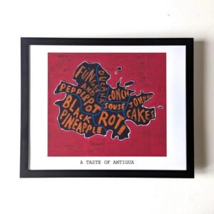 Framed artwork depicting a stylized map of Antigua on a red background with words like “Roti” and “Pepperpot.” Caption reads “A Taste of Antigua.”