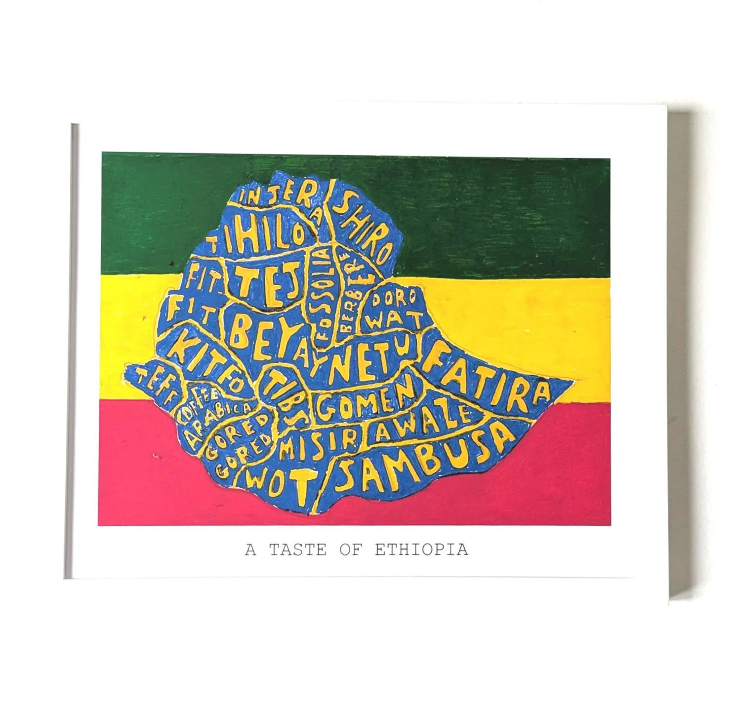 Map of Ethiopia outlined in blue on an Ethiopian flag background. Words like "Shiro," "Doro Wat," and "Injera" fill the shape. Text reads "A Taste of Ethiopia."