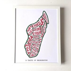 Map of Madagascar outlined in green, filled with red words naming local foods like 'Vanilla' and 'Chocolat.' Below, text reads "A Taste of Madagascar."