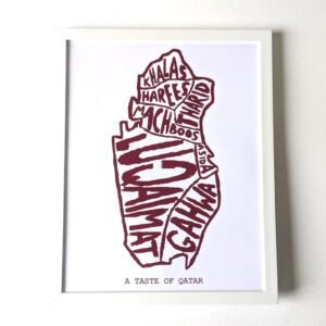 Framed artwork depicting Qatar’s shape filled with names of traditional dishes like machboos and luqaimat in bold maroon text. Caption reads "A Taste of Qatar."